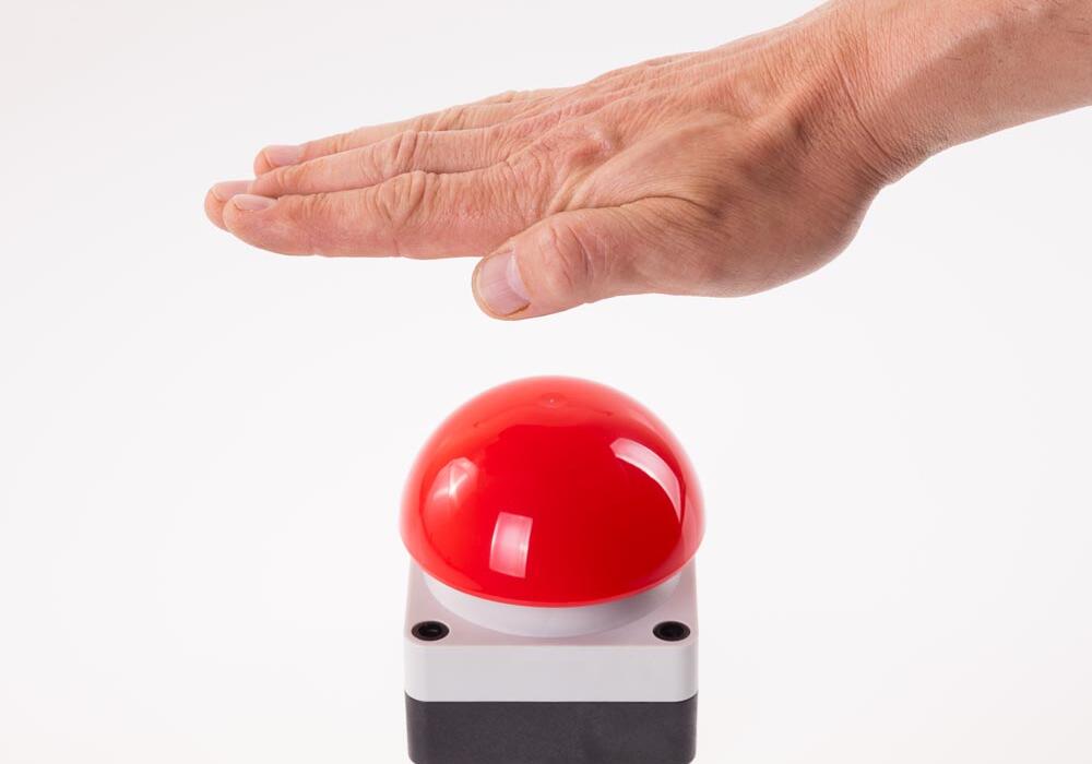 Hand on buzzer