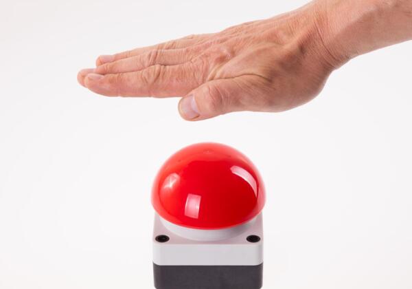 Hand on buzzer